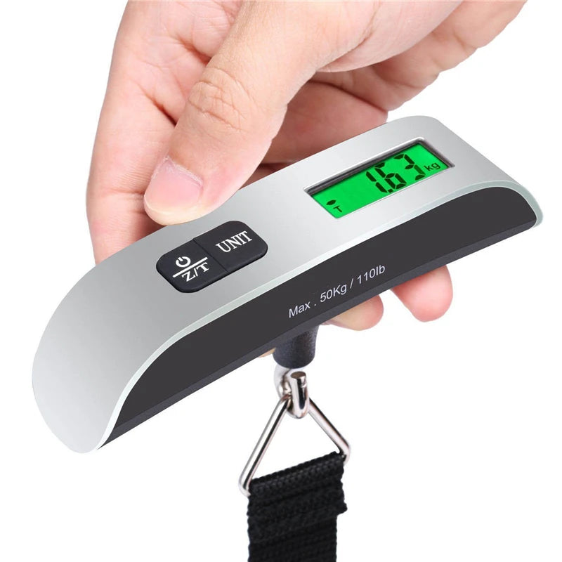 Digital luggage scale weighing a suitcase by the handle